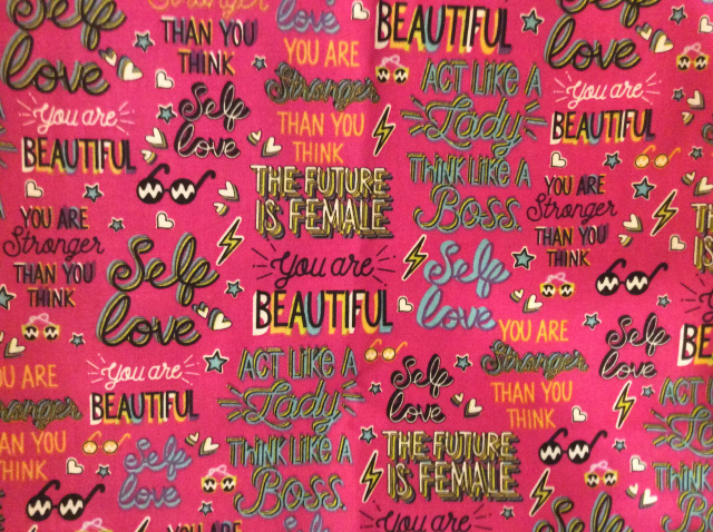 Bright pink background with words of empowerment for girls