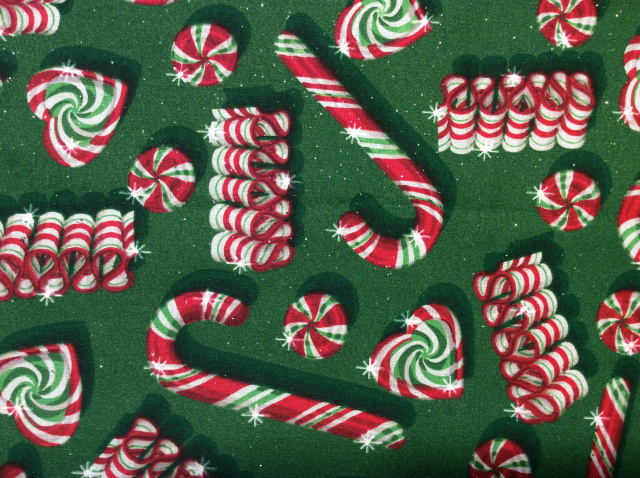 Candy canes/ribbon candy/peppermints in red/white/green on a green sparkly background