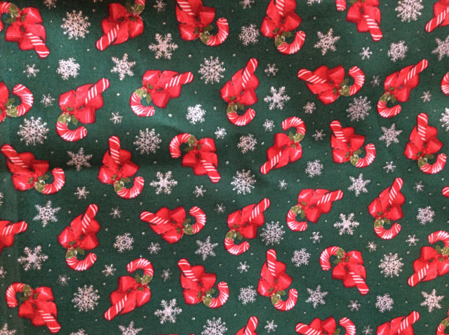 Red/white candy canes with red bows and silver snowflakes on bright green