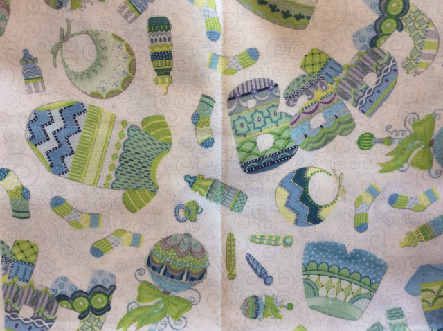 Blue-lime-green baby boy shirts, rattles, nuks, bibs, socks on white