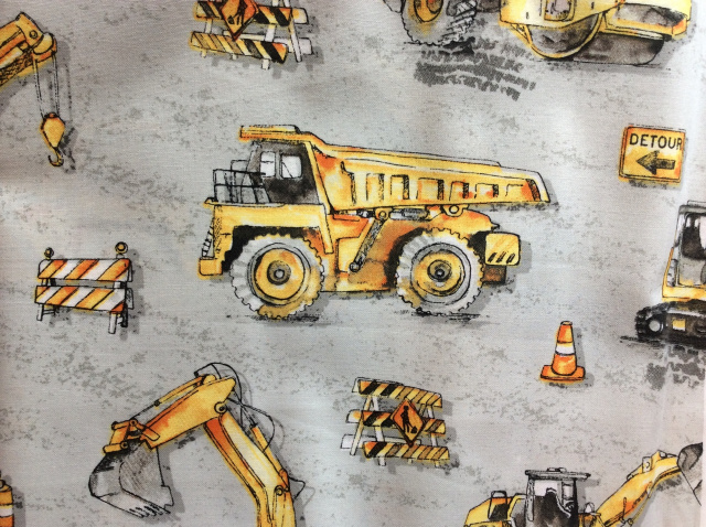 Large yellow construction trucks on light gray