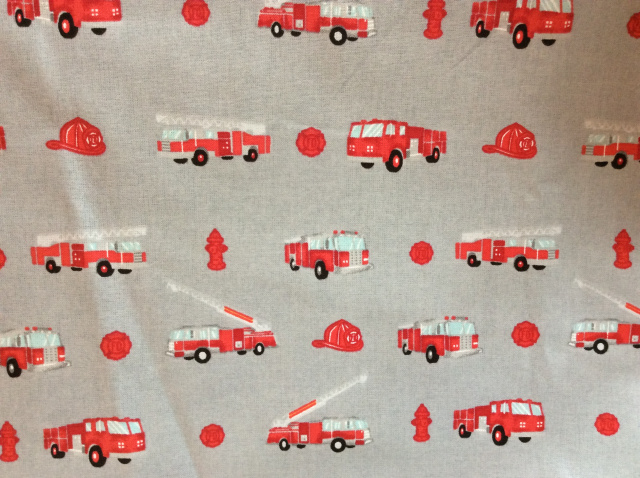 Little red fire engines on gray