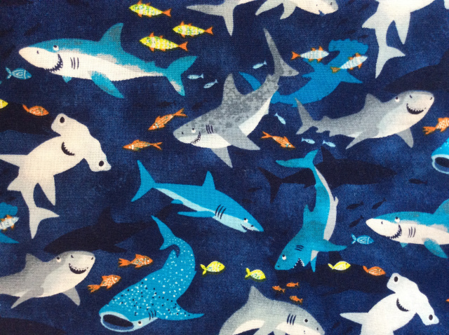 Smiling sharks of all types on dark royal blue