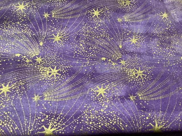 Gold shooting stars on lavender
