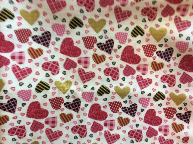 Patterned designs inside pink,gold, and black hearts on white 