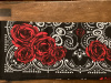 Red roses on a black background with white paisley