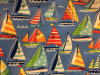 Sailboats in primary colors with patterned sales on sky blue