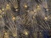 Gold shooting stars on black