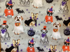 Labs, Dalmatians, French bulldogs, and corgis in Halloween costumes on gray