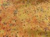 Confetti colors of blue,orange,lavender on yellow