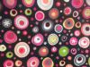 Charcoal background with bright circles of color in varying sizes.  Circle colors include pink, hot 